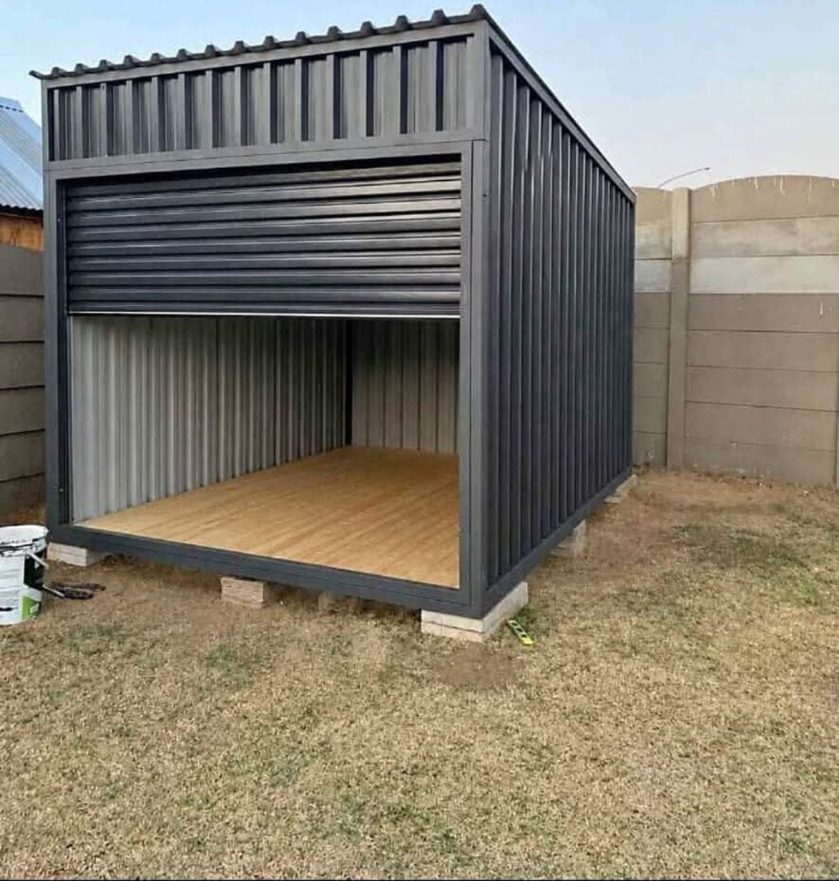 Steel unit on concrete pads, timber floor