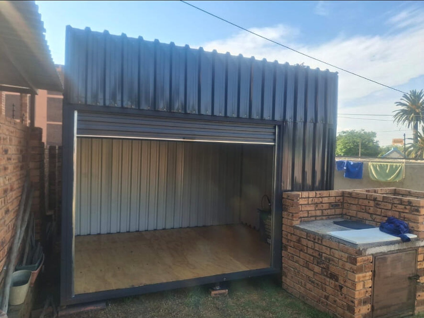 Open roller-door unit with timber floor